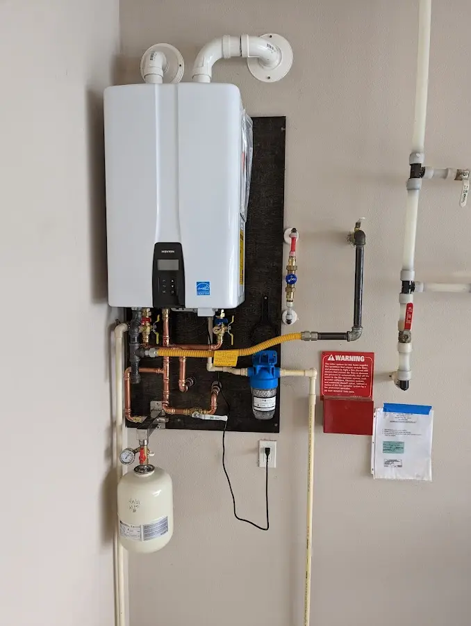 Professional plumber installing copper piping in a Naples home